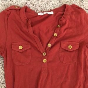 Orange button up top